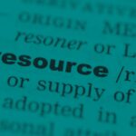 Close-up view of printed text focusing on the word ‘resource.’