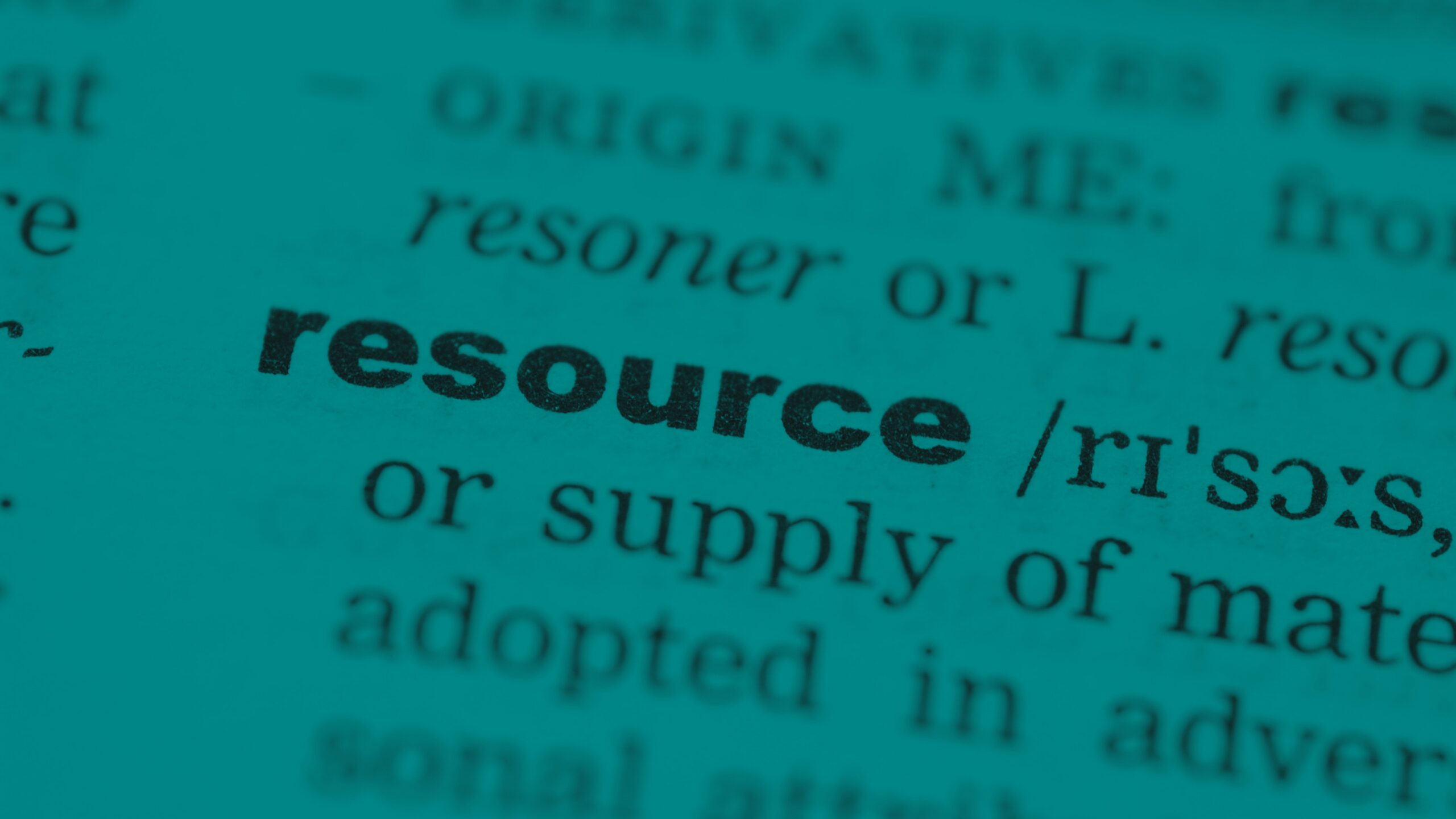 Close-up view of printed text focusing on the word ‘resource.’
