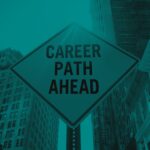 Road sign reading "Career Path Ahead" positioned among tall city buildings.