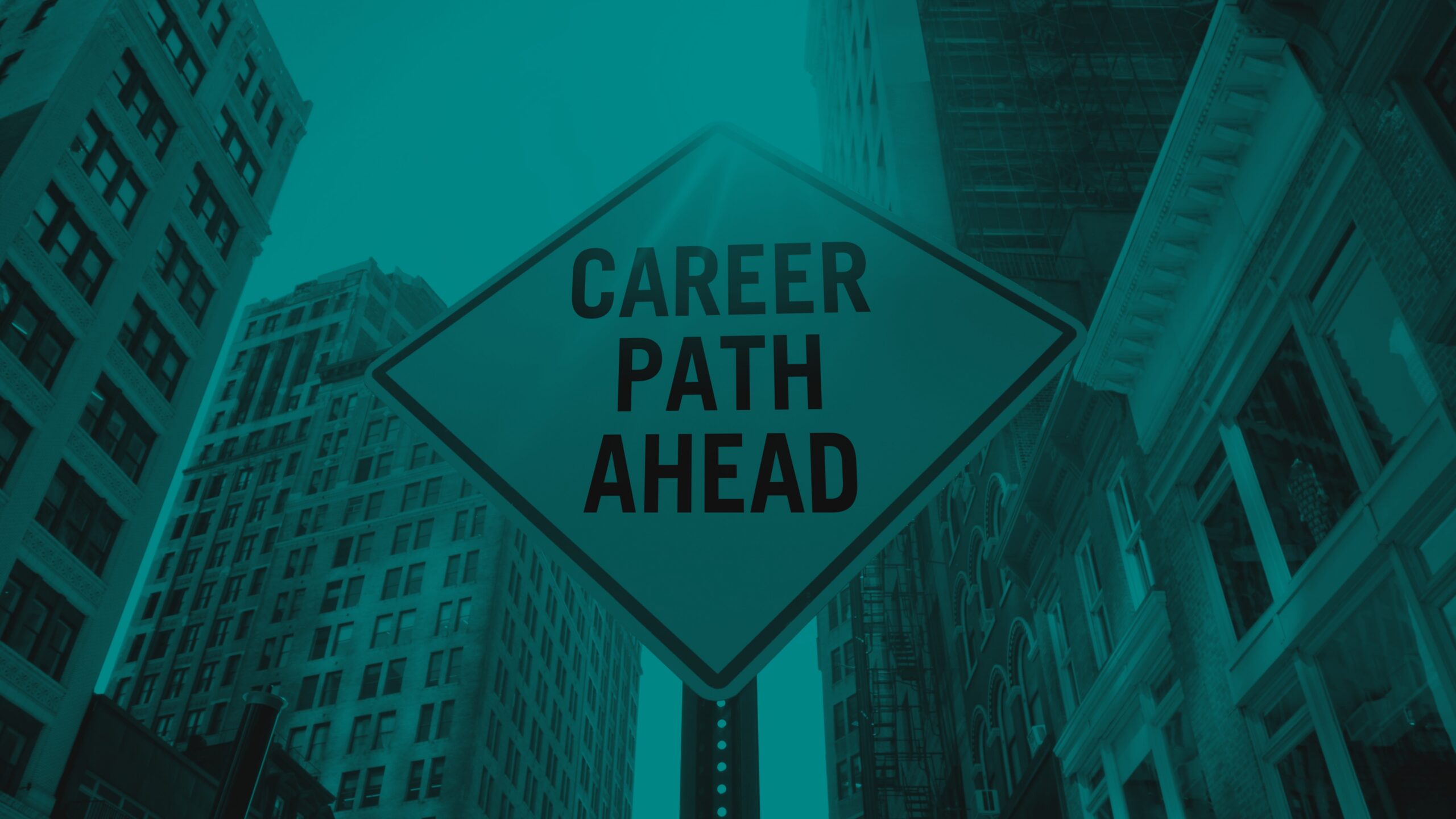 Road sign reading "Career Path Ahead" positioned among tall city buildings.
